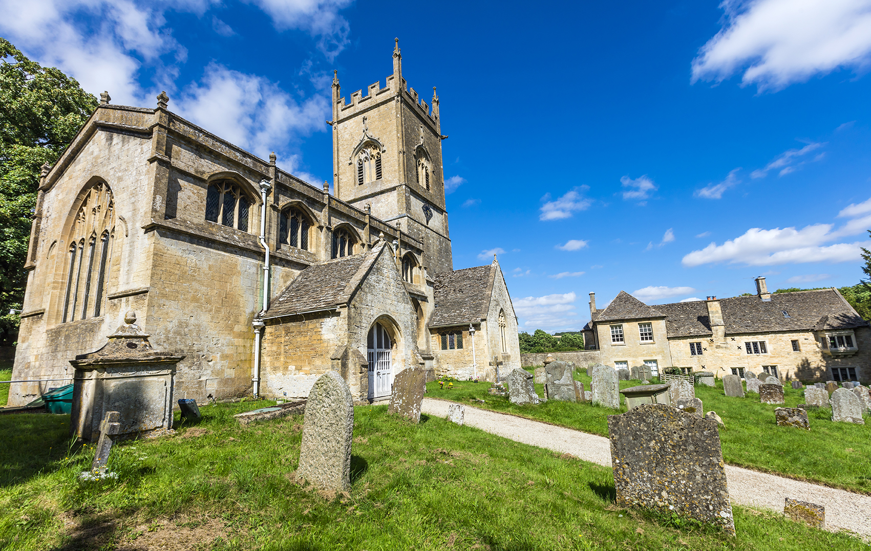 Typical rural English village church and cemetery in the Cotswolds